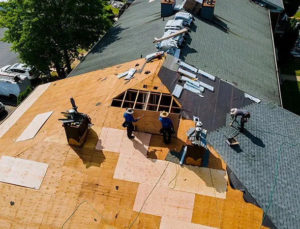 A roofing specialists evaluating a roof, demonstrating their proficiency in providing reliable roofing solutions.